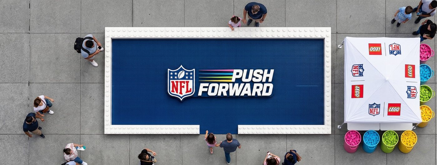 Push Forward brick installation from above, with brick buckets and an NFL x LEGO tent